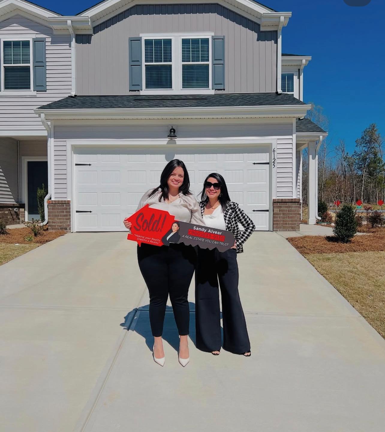 Sandy Alvear with clients on closing day celebration